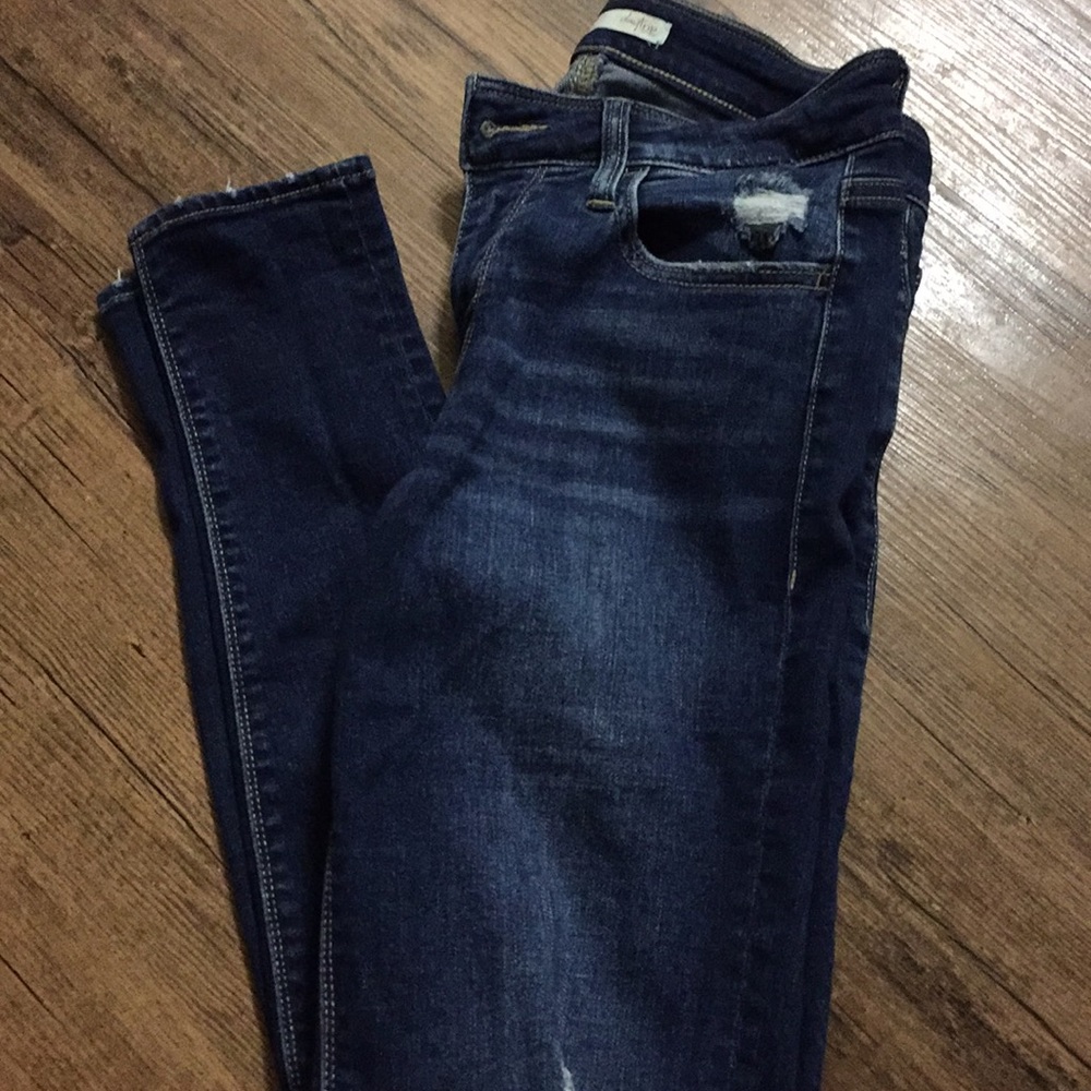 Distressed dark wash jeans